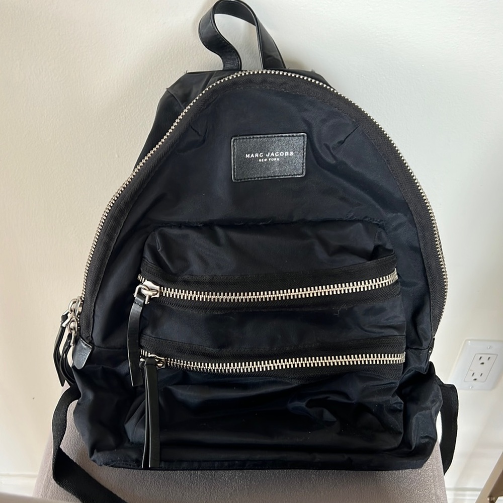 Marc Jacob’s nylon backpack. Black with silver zippers.